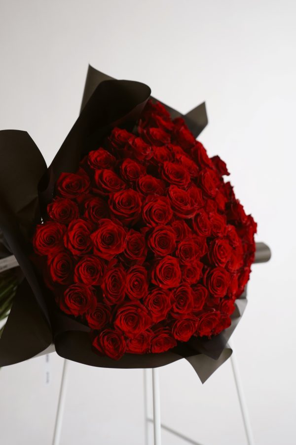 Classic Charm bouquet of red roses wrapped in black paper by DV Flowers