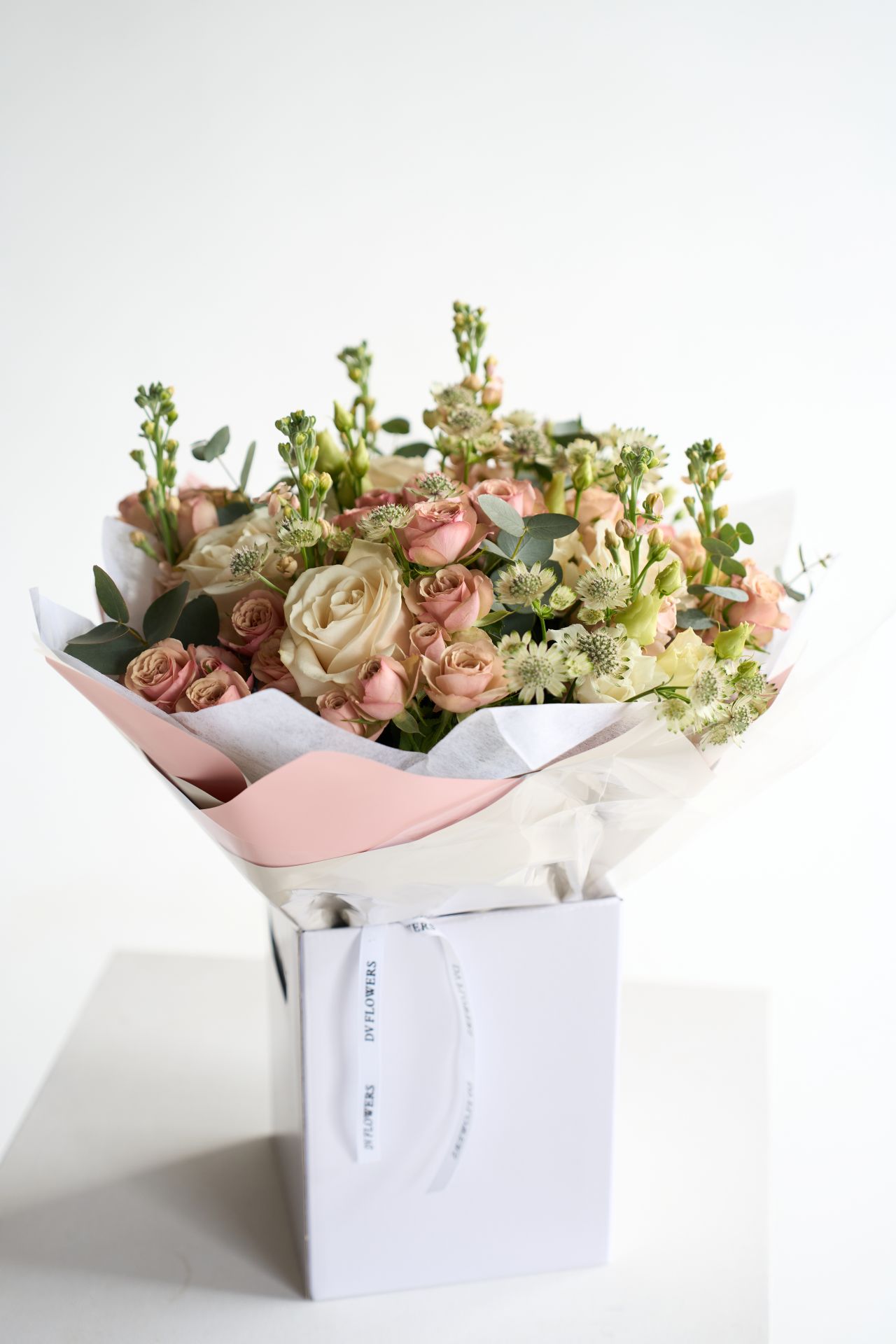 Pastel Luxe bouquet with blush roses and seasonal flowers by DV Flowers