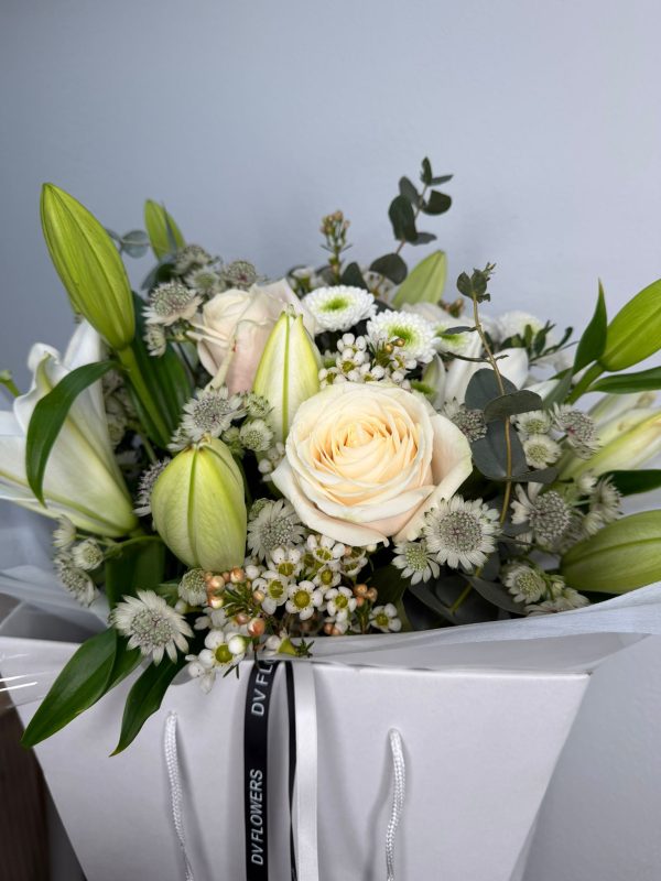 White Symphony bouquet with white lilies and ivory roses in DV Flowers gift bag