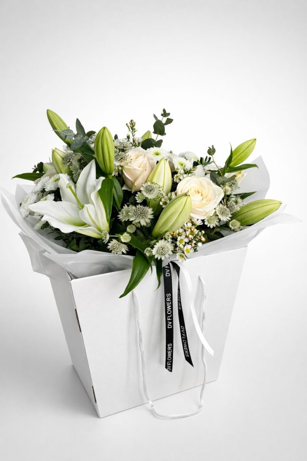 White Symphony bouquet with white lilies and ivory roses in DV Flowers gift bag White Symphony bouquet with white lilies and ivory roses in DV Flowers gift bag